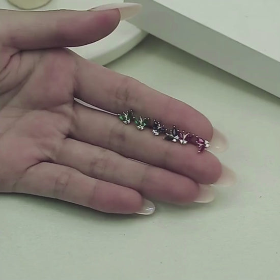 A video showing the Blue CZ Butterfly Studs.