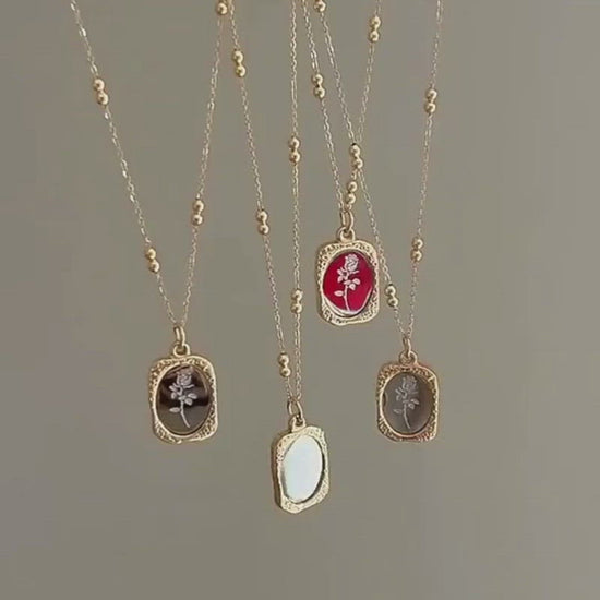 A video showing the Mirrored Birth Flower Gold Necklace.