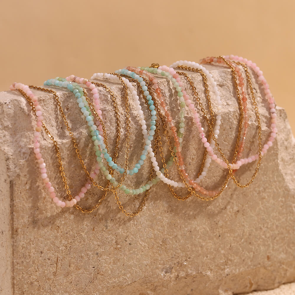 Multiple gemstone beaded anklets.