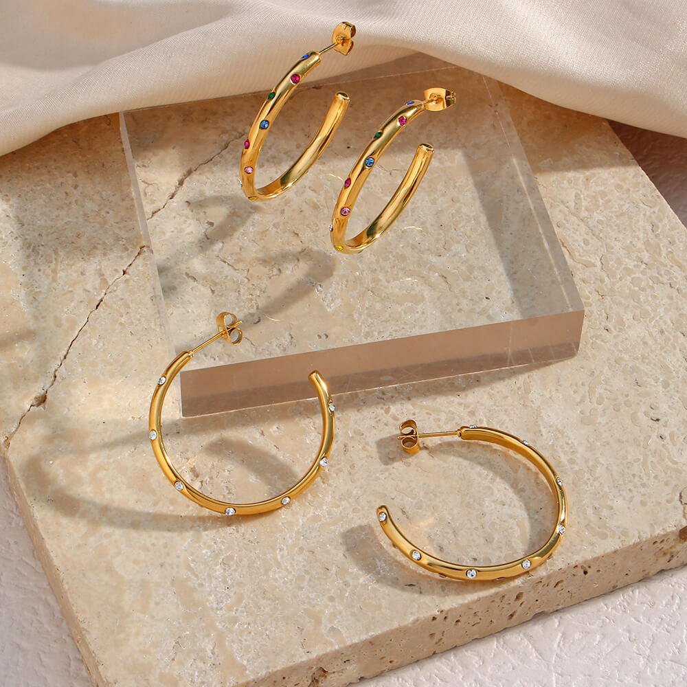 Gold hoops with CZ stones.