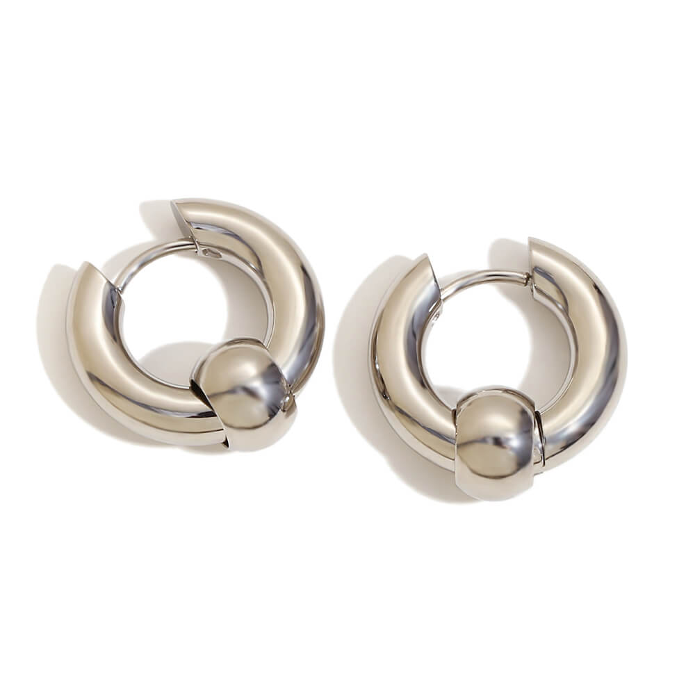 Pair of silver hoop earrings on a white background.