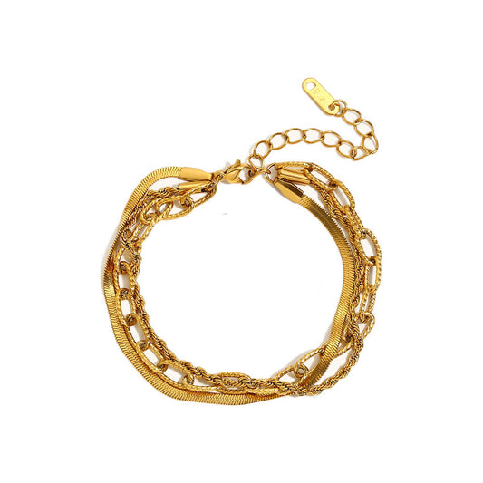 Multi-Layered Gold Bracelet Stack.