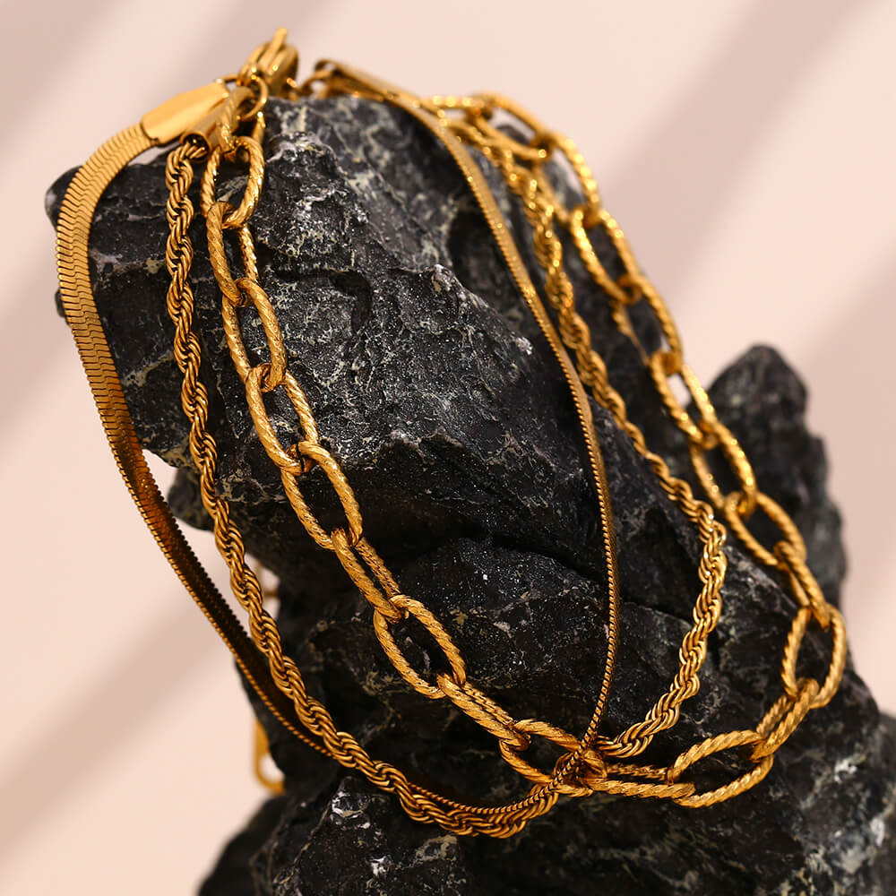 Gold chain bracelet set.