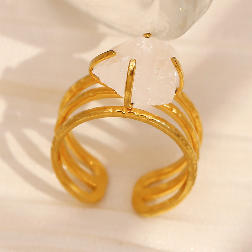 Prong set raw quartz gold ring.