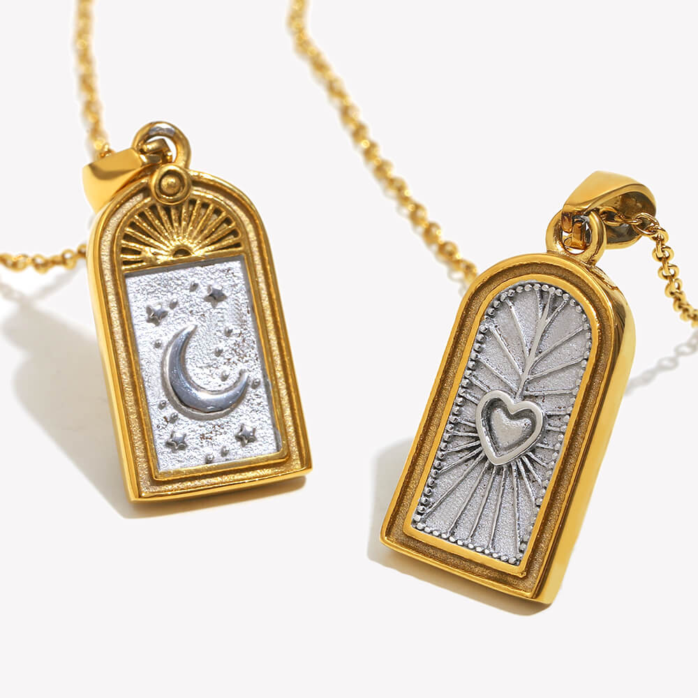 Two gold pendants with engraved celestial designs on a white background.