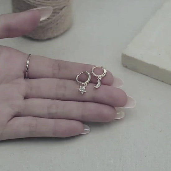 A video showing the Star & Moon CZ Huggies.