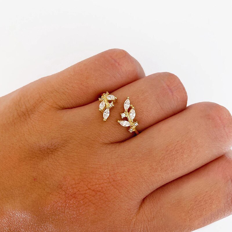 A model wearing a gold branch ring.