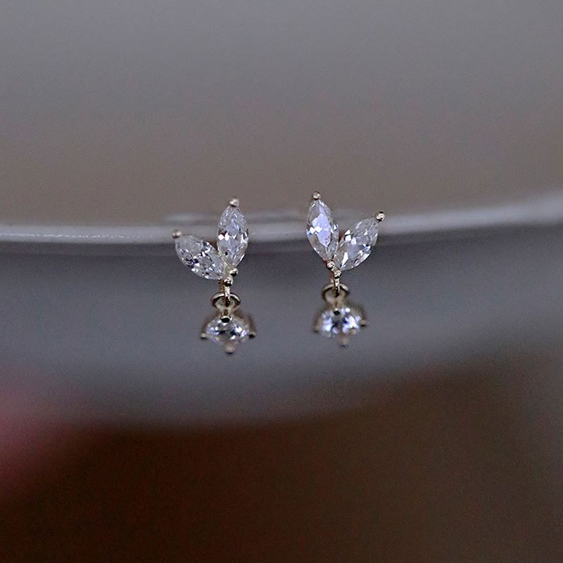 Dainty gold cubiz zirconia stud earrings.