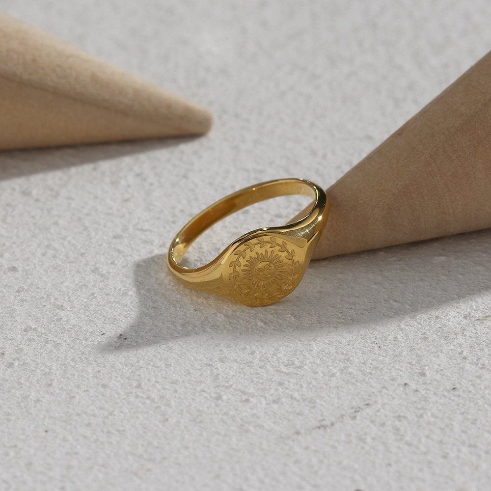 Gold signet ring.